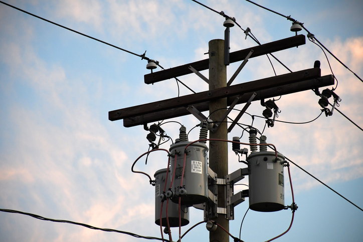 photo of a utility pole with transformers, showcasing telecommunications sheet metal fabrication